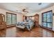 Large bedroom with hardwood floors, big windows, and nice furniture at 4075 E Oquendo Rd, Las Vegas, NV 89120