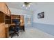 A well-lit office space with built-in shelves and a desk, perfect for working from home at 4075 E Oquendo Rd, Las Vegas, NV 89120