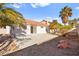Private backyard with a patio area and low-maintenance desert landscaping at 433 Old Palms Dr, Las Vegas, NV 89123