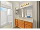 Well-lit bathroom with a single sink vanity and a shower at 433 Old Palms Dr, Las Vegas, NV 89123