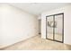Bedroom featuring a mirrored closet, offering practical storage solutions at 433 Old Palms Dr, Las Vegas, NV 89123