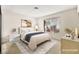 Staged bedroom with neutral decor and comfortable furniture at 433 Old Palms Dr, Las Vegas, NV 89123