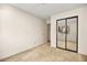 Bedroom featuring neutral walls, carpet, and a mirrored closet at 433 Old Palms Dr, Las Vegas, NV 89123