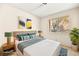 Comfortable bedroom featuring a large bed, stylish decor, and a window offering natural light at 433 Old Palms Dr, Las Vegas, NV 89123