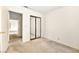 Neutral bedroom featuring a mirrored closet and access to connecting rooms at 433 Old Palms Dr, Las Vegas, NV 89123