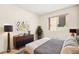 Staged bedroom featuring modern furniture, a sleek platform bed, and a large window for natural light at 433 Old Palms Dr, Las Vegas, NV 89123