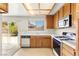 Bright kitchen with wood cabinets, white countertops, and stainless-steel appliances at 433 Old Palms Dr, Las Vegas, NV 89123