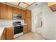 Functional kitchen features wooden cabinets and stainless steel microwave at 433 Old Palms Dr, Las Vegas, NV 89123