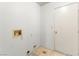 This laundry room features essential hookups and a door for easy access at 433 Old Palms Dr, Las Vegas, NV 89123