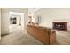 Open-concept living room with fireplace and sliding door access to the backyard at 433 Old Palms Dr, Las Vegas, NV 89123