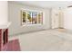 Inviting living room with large window and fireplace, complemented by neutral paint at 433 Old Palms Dr, Las Vegas, NV 89123