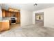 Open kitchen and living area leading to a sunlit sitting room at 433 Old Palms Dr, Las Vegas, NV 89123