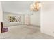 The living room features a fireplace, large window and is painted with neutral tones at 433 Old Palms Dr, Las Vegas, NV 89123