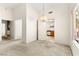 Open-concept living room with bright lighting and views to the kitchen and dining area at 433 Old Palms Dr, Las Vegas, NV 89123