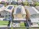Aerial view of a home featuring solar panels, a firepit, and manicured landscaping at 4519 Stardusk Falls Ave, North Las Vegas, NV 89084