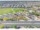Aerial view of neighborhood amenities including green spaces, landscaping, and parking areas at 4519 Stardusk Falls Ave, North Las Vegas, NV 89084