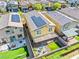 Aerial view of a home with solar panels, covered patio, and landscaped backyard with a fire pit at 4519 Stardusk Falls Ave, North Las Vegas, NV 89084