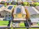 Aerial view of a home featuring solar panels, an outdoor lounge area, and a well-manicured lawn at 4519 Stardusk Falls Ave, North Las Vegas, NV 89084