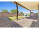 Spacious backyard with low-maintenance landscaping, covered patio and artificial turf at 4519 Stardusk Falls Ave, North Las Vegas, NV 89084