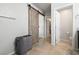 Bathroom doorway next to barn door for added privacy and a stylish touch to the space at 4519 Stardusk Falls Ave, North Las Vegas, NV 89084