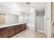 Bright bathroom features double sinks, granite countertops, separate shower, tub, and barn door at 4519 Stardusk Falls Ave, North Las Vegas, NV 89084