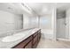 Bright bathroom features double sinks, granite countertops, and separate shower and tub for convenience and luxury at 4519 Stardusk Falls Ave, North Las Vegas, NV 89084