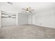 Expansive bedroom with modern ceiling fan, decorative wall and built in shelving above the window for added storage at 4519 Stardusk Falls Ave, North Las Vegas, NV 89084