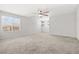 Spacious bedroom featuring plush carpeting, ceiling fan, view, and freshly painted walls at 4519 Stardusk Falls Ave, North Las Vegas, NV 89084