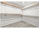 Walk-in closet with wooden shelves and carpet flooring providing an organized space for clothing and accessories at 4519 Stardusk Falls Ave, North Las Vegas, NV 89084