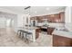 Modern kitchen boasts granite countertops, stainless steel appliances, and a spacious island with seating at 4519 Stardusk Falls Ave, North Las Vegas, NV 89084
