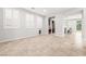 Spacious open living area with tile flooring, bright windows, and access to the backyard at 4519 Stardusk Falls Ave, North Las Vegas, NV 89084