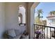 A covered outdoor patio balcony provides shade and seating with decorative stonework at 50 Aura De Blanco St # 18204, Henderson, NV 89074