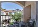 Cozy balcony features a wrought iron railing, views of the neighborhood and seating at 50 Aura De Blanco St # 18204, Henderson, NV 89074