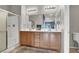 Modern bathroom with dual sinks, walk-in shower, and neutral decor at 50 Aura De Blanco St # 18204, Henderson, NV 89074