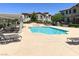 A community pool offers lounge seating, shade, and a relaxing atmosphere at 50 Aura De Blanco St # 18204, Henderson, NV 89074