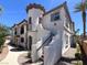 Charming townhome featuring a unique turret entrance and well-maintained landscaping at 50 Aura De Blanco St # 18204, Henderson, NV 89074