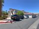Community architecture features stucco construction, red tile roofs, and mature desert landscaping at 50 Aura De Blanco St # 18204, Henderson, NV 89074