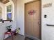 Inviting front door with a 'Welcome' wreath, and a well-kept entry area at 50 Aura De Blanco St # 18204, Henderson, NV 89074