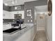 Stylish kitchen with stainless steel appliances and concrete countertops at 50 Aura De Blanco St # 18204, Henderson, NV 89074