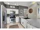 Well-equipped kitchen features stainless steel appliances and white cabinetry at 50 Aura De Blanco St # 18204, Henderson, NV 89074