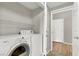 Laundry room equipped with washer and dryer, and shelving at 50 Aura De Blanco St # 18204, Henderson, NV 89074
