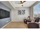 Cozy living area with wood floors and large TV, ideal for entertainment at 50 Aura De Blanco St # 18204, Henderson, NV 89074