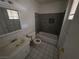 This bathroom features tile flooring, a shower-tub combo, and a vanity with plenty of counter space at 5390 Swenson St # 27, Las Vegas, NV 89119