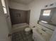 Bathroom featuring tiled shower-tub combo and single sink vanity at 5390 Swenson St # 27, Las Vegas, NV 89119