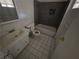 This bathroom features tile flooring, a shower-tub combo, and a vanity with plenty of counter space at 5390 Swenson St # 27, Las Vegas, NV 89119
