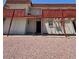 Exterior of unit 27 with red support beams and a small upper balcony at 5390 Swenson St # 27, Las Vegas, NV 89119