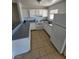 Bright kitchen featuring white cabinets, countertops, and appliances at 5390 Swenson St # 27, Las Vegas, NV 89119