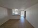 Spacious living room featuring tile floors, with views into the kitchen at 5390 Swenson St # 27, Las Vegas, NV 89119