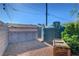 The property includes a backyard with a large water storage tank and a small storage shed at 5725 N Durango Dr, Las Vegas, NV 89149