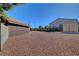 Gravel backyard with block fencing for privacy, offering a low-maintenance outdoor space at 5725 N Durango Dr, Las Vegas, NV 89149